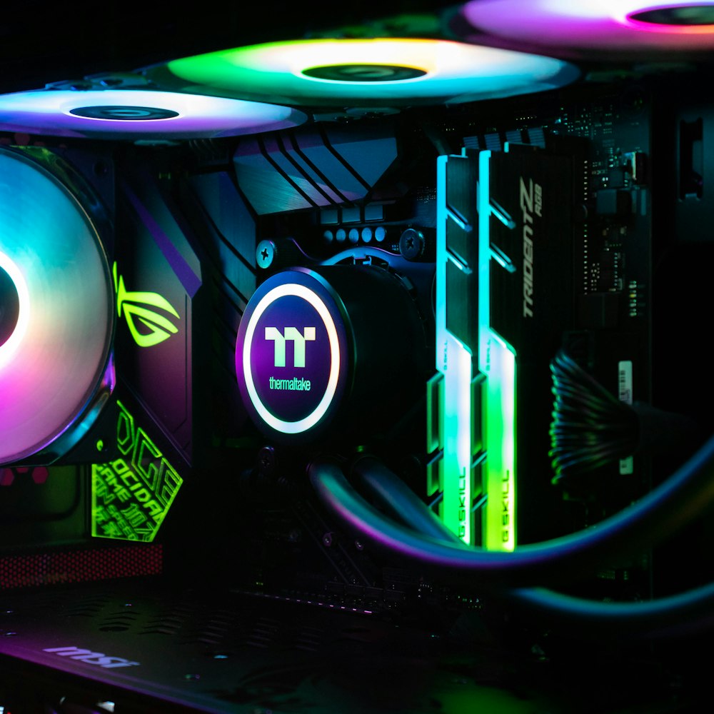 High-performance gaming PC with RGB lighting, Thermaltake cooler, and premium components